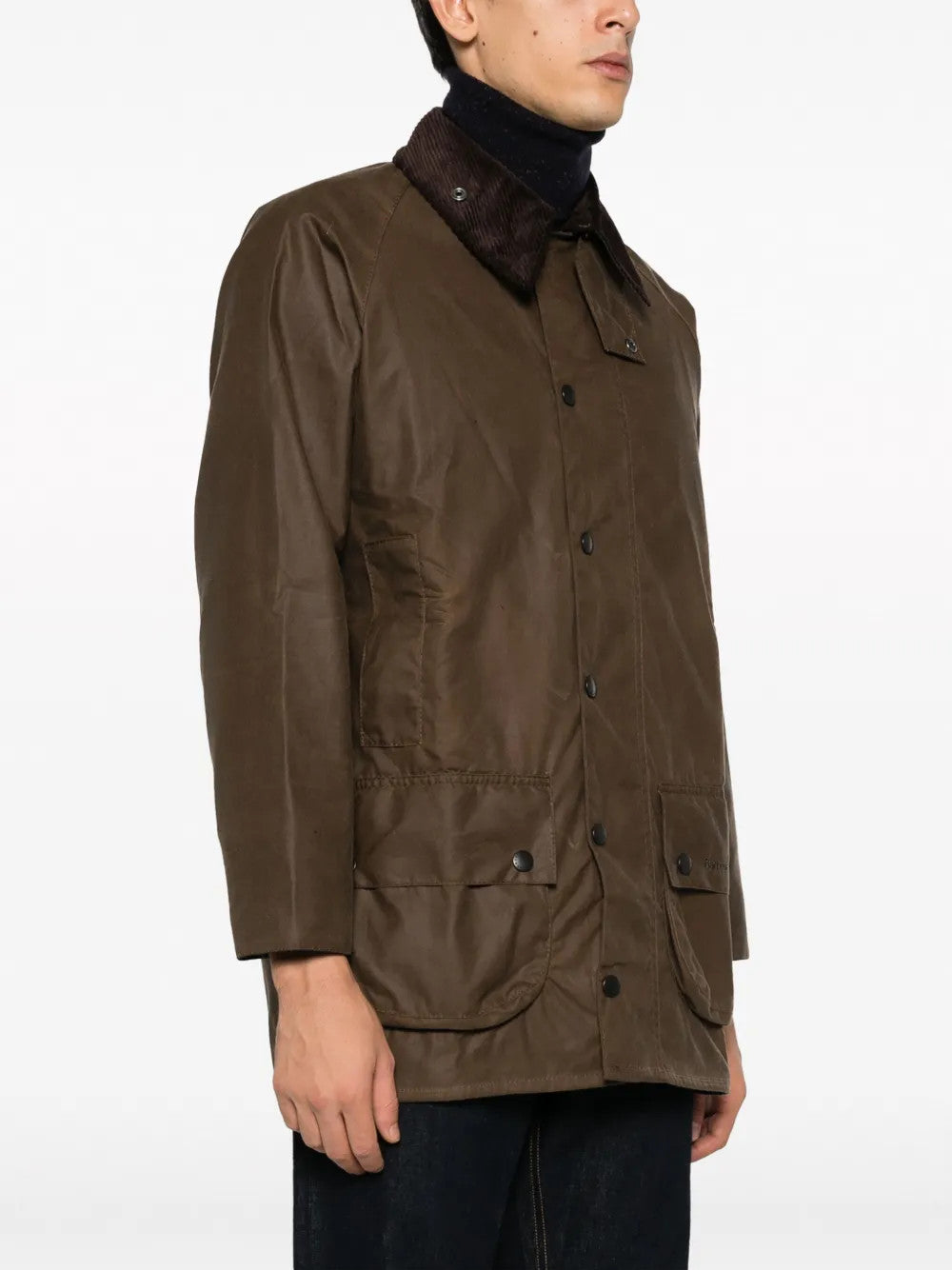 Brown jacket worn by a person, showing the jacket fit