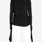 Black top worn by a person, showing the top's fit