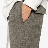 Grey pants worn by a person, showing the pants fit