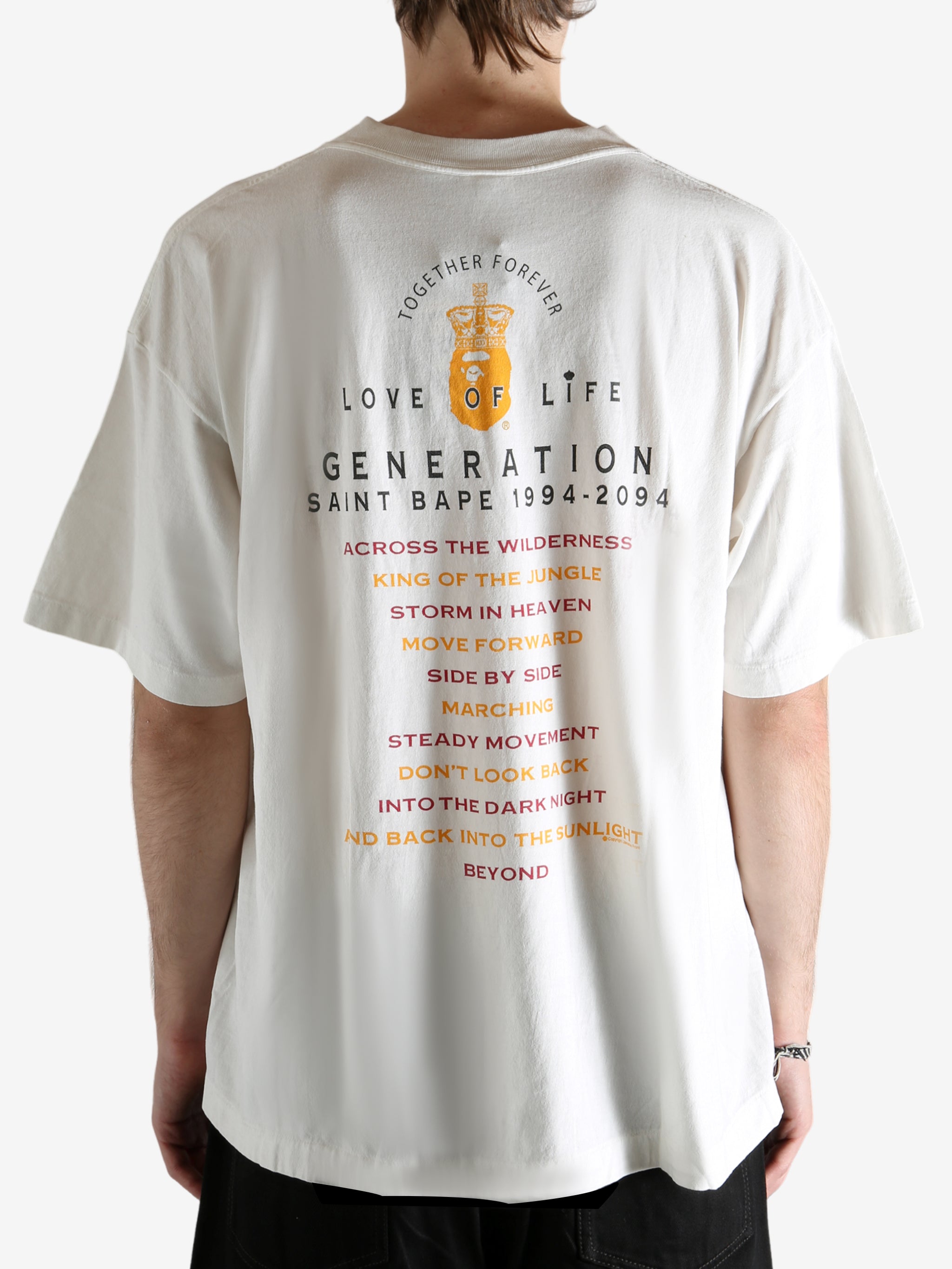 White t-shirt worn by a person, showing the t-shirt's fit