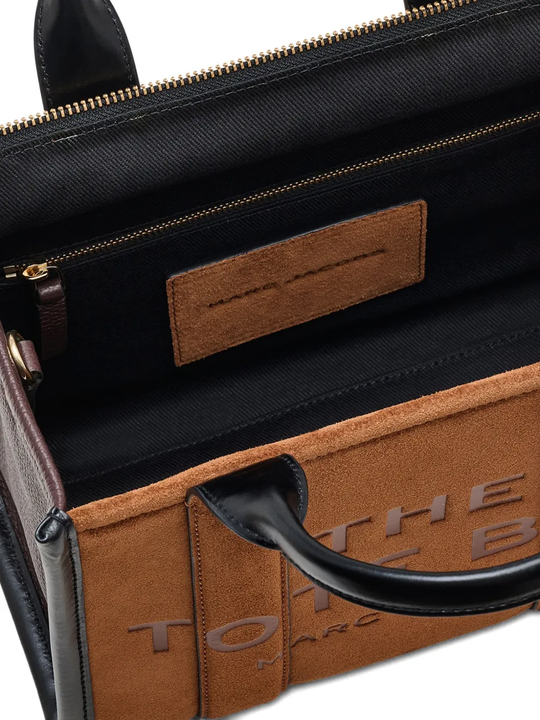 Close up of the brown flats, showing texture of the suede fabric