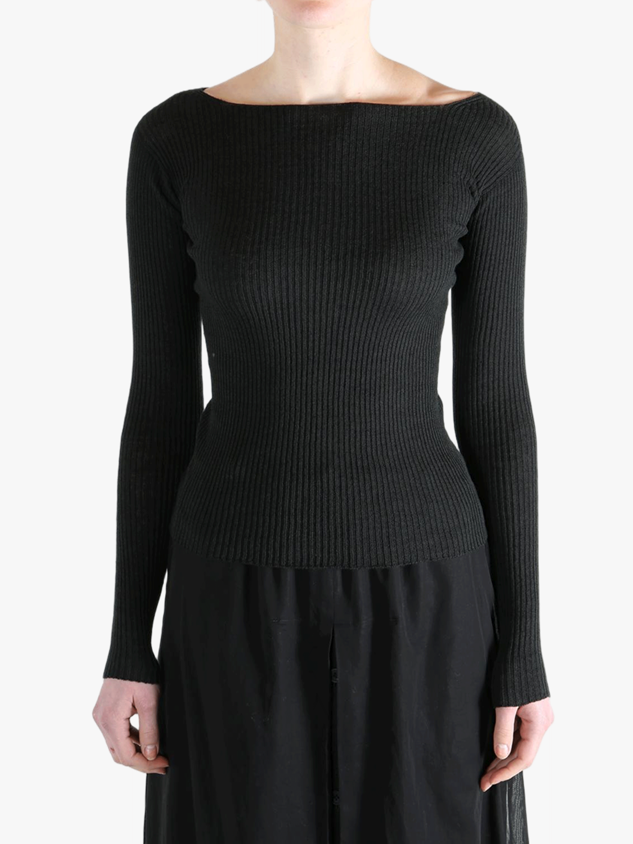 Black knitear worn by a person, showing the knitwear's fit