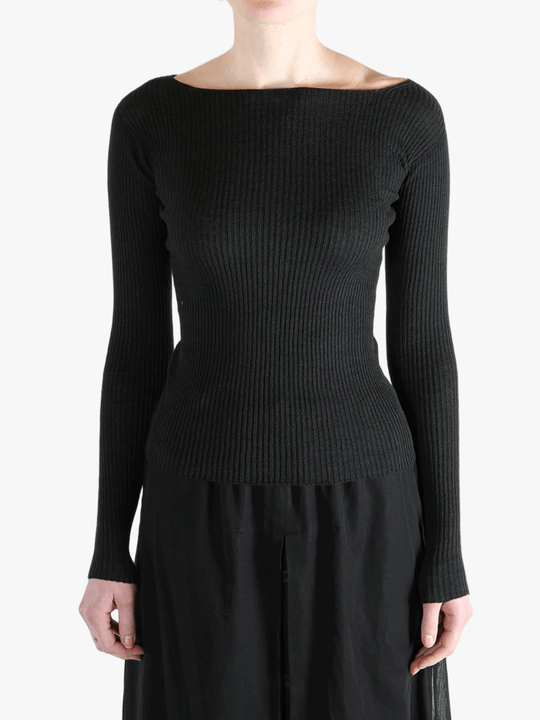 Black knitear worn by a person, showing the knitwear's fit