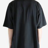 Black t-shirt worn by a person, showing the t-shirt's fit