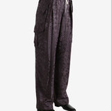 Brown pant worn by a person, showing the pant's fit