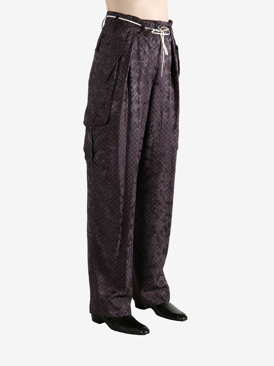 Brown pant worn by a person, showing the pant's fit