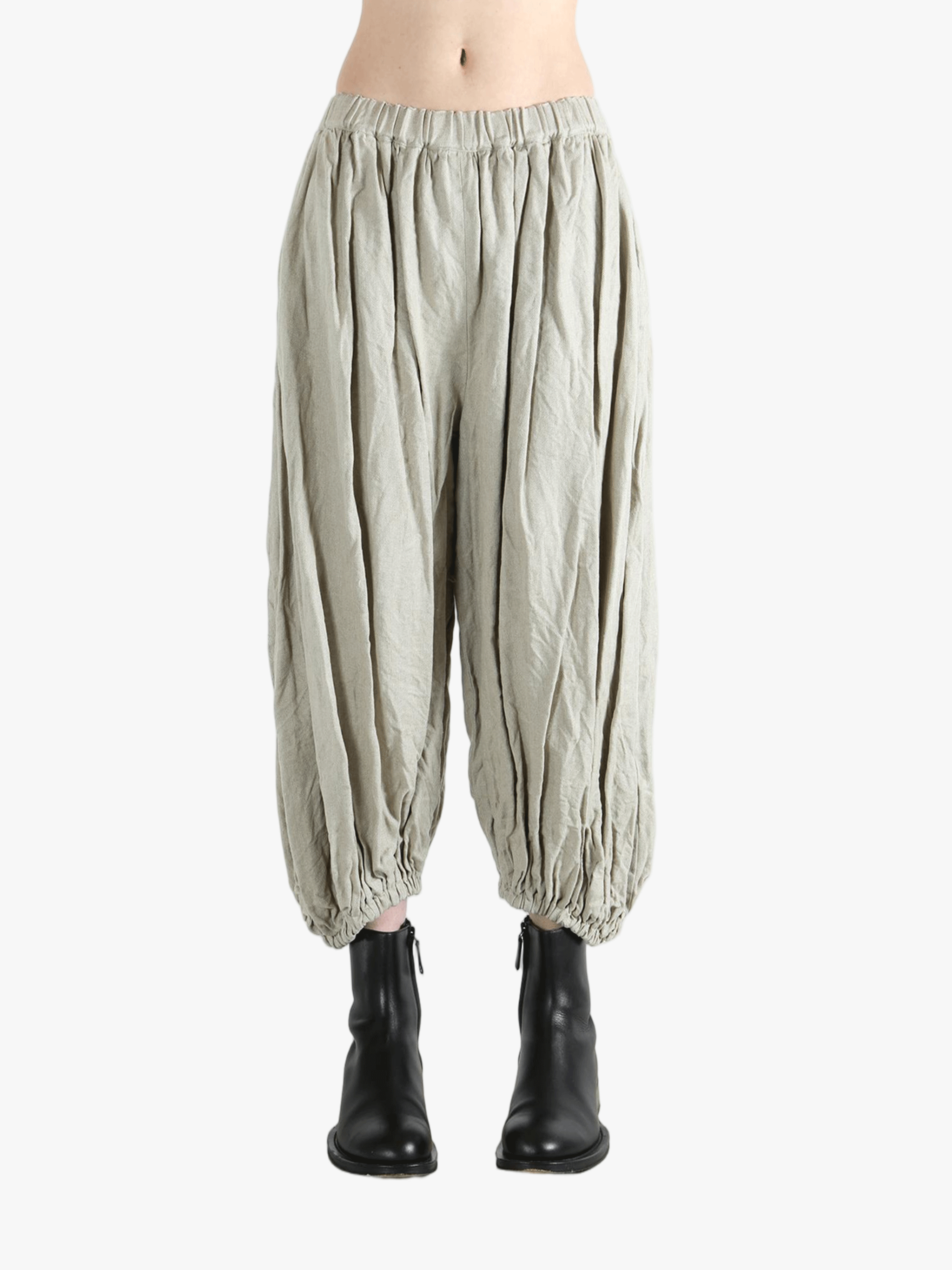 Grey pants worn by a person, showing the pants fit