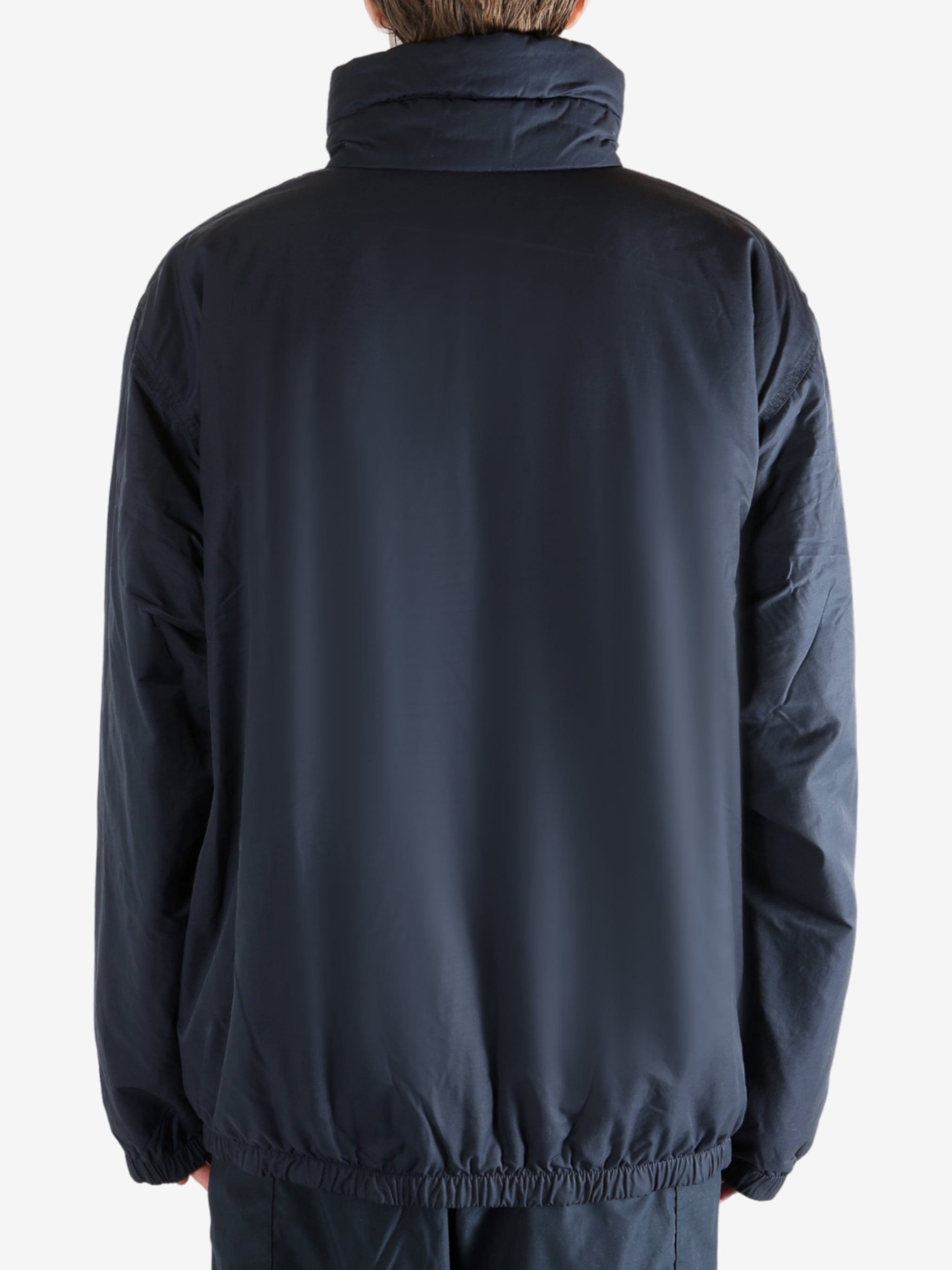 Navy jacket worn by a person, showing the jacket's fit