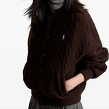 Brown jacket worn by a person, showing the jacket fit