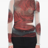 White top worn by a person, showing the top's fit