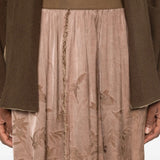 Brown skirt worn by a person, showing the skirt fit