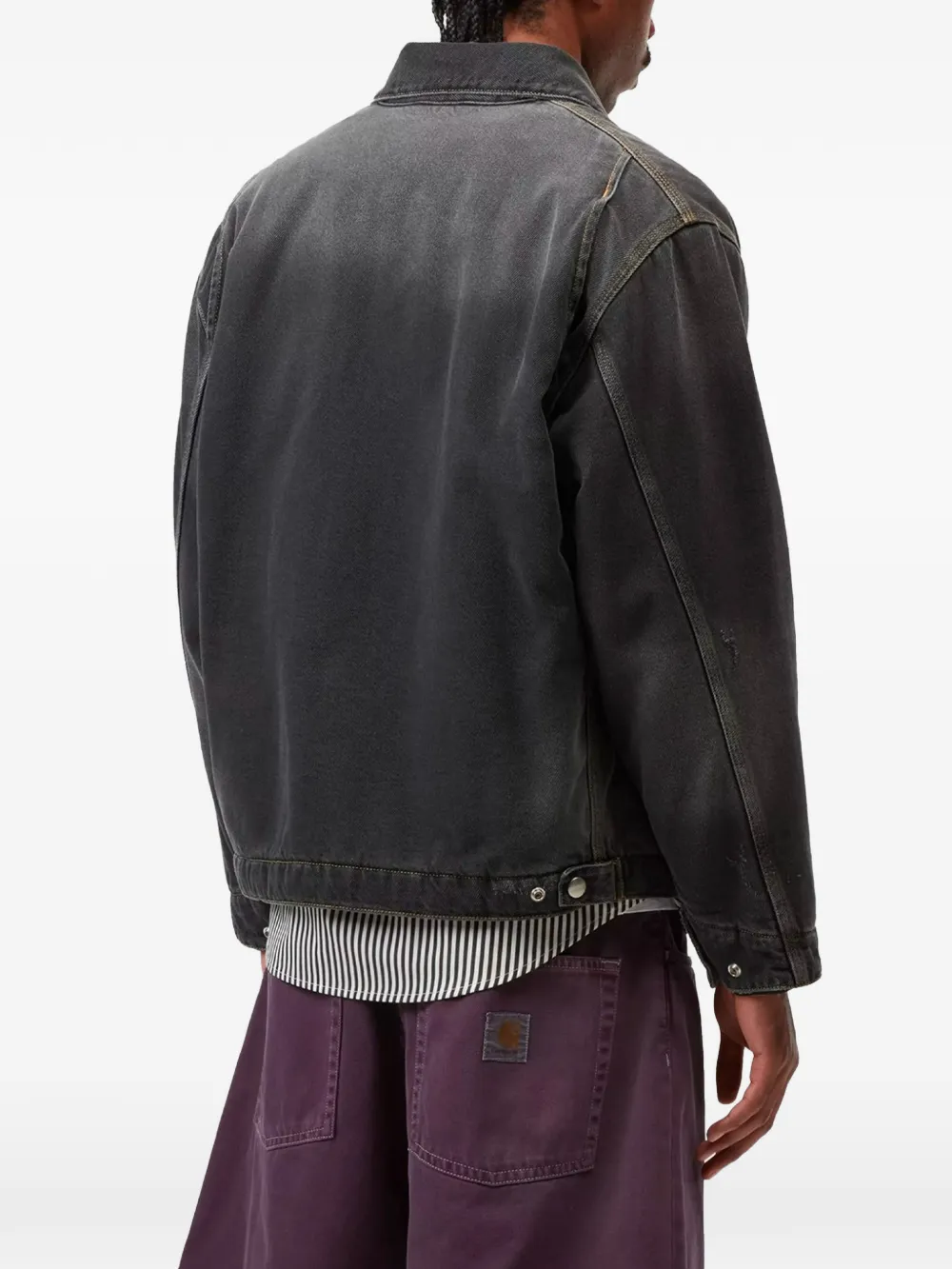 black jackets-coats worn by a person, showing the jackets-coats fit