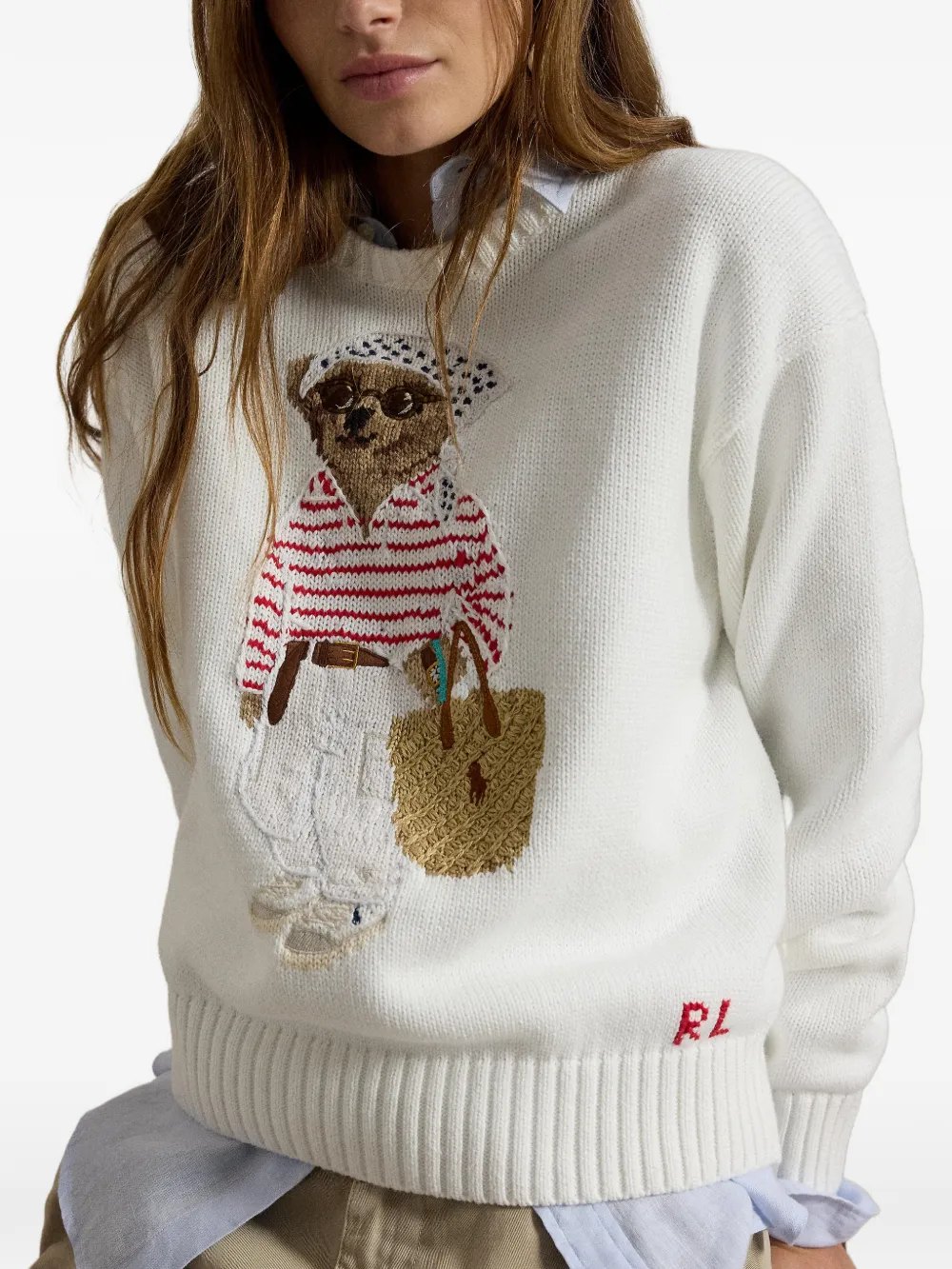 White knitwear worn by a person, showing the knitwear's fit