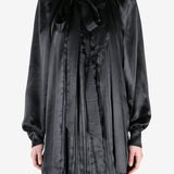 Black shirt worn by a person, showing the shirt fit