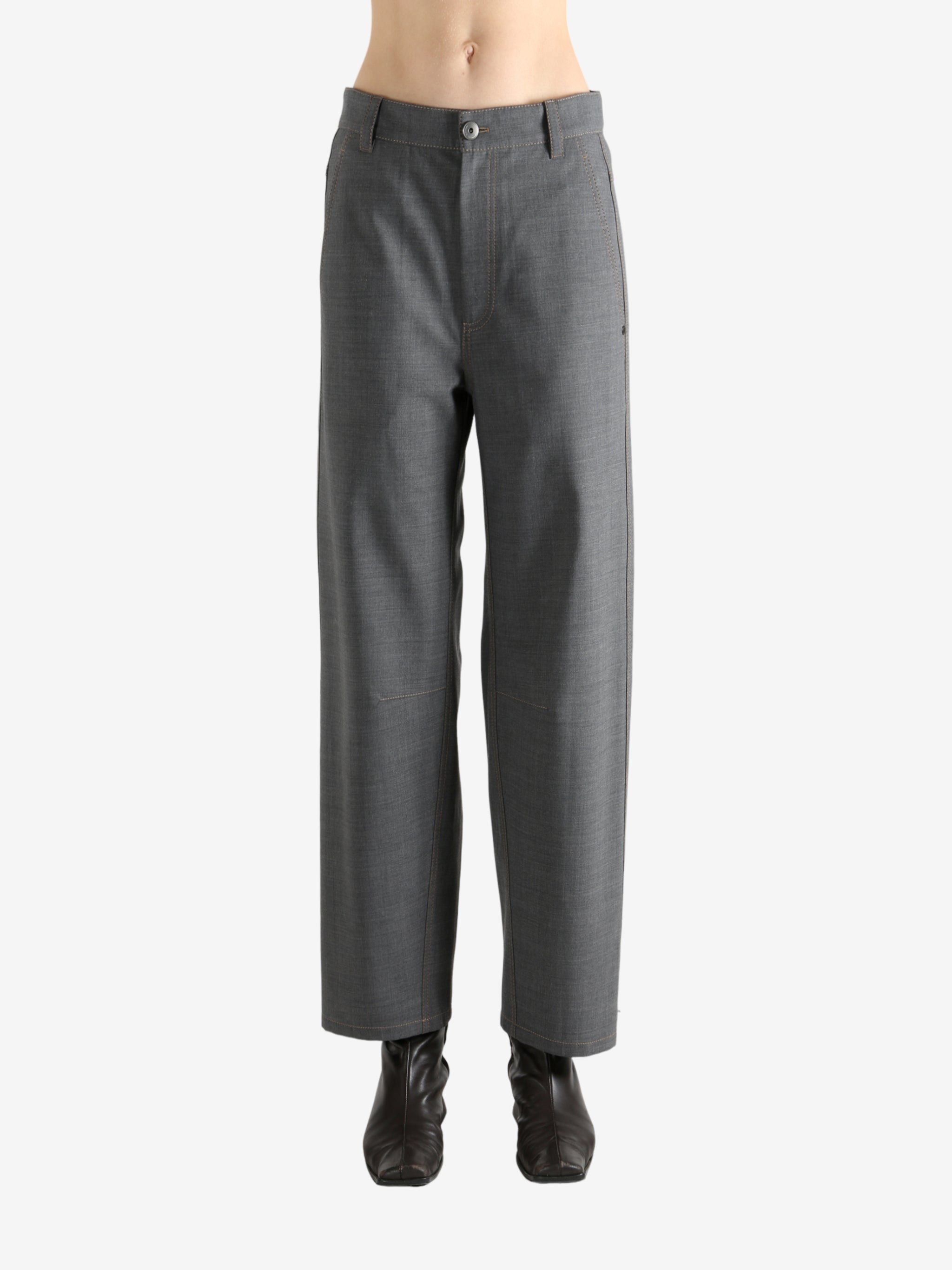 Grey pants worn by a person, showing the pants fit