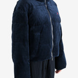 Navy coats worn by a person, showing the coats fit