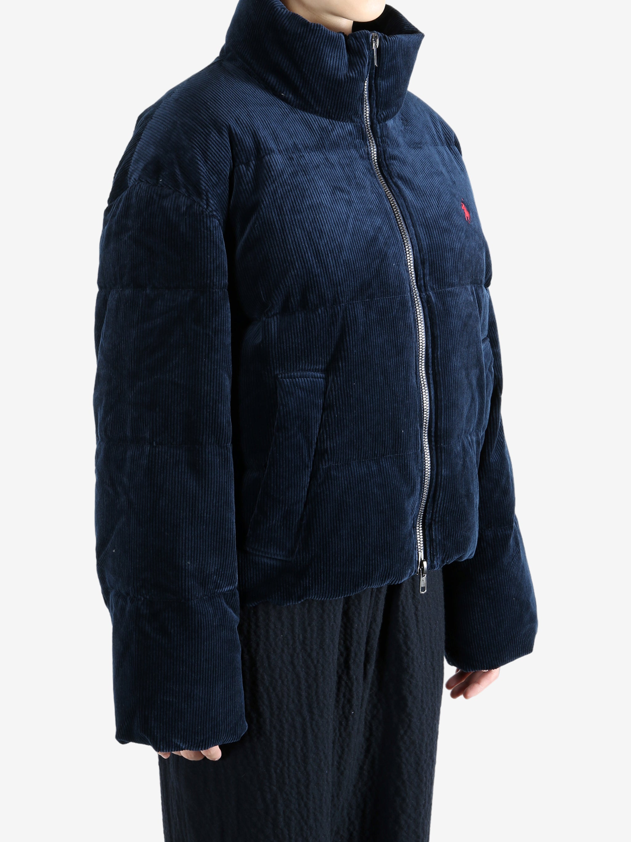 Navy coats worn by a person, showing the coats fit