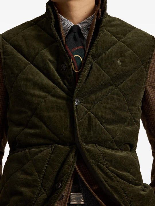 Green jacket worn by a person, showing the jacket fit