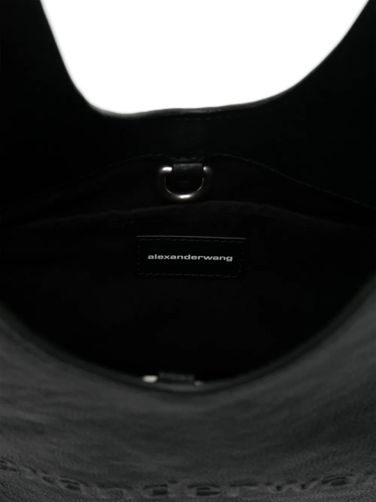 Close up of black bag,showing texture of the leather fabric.