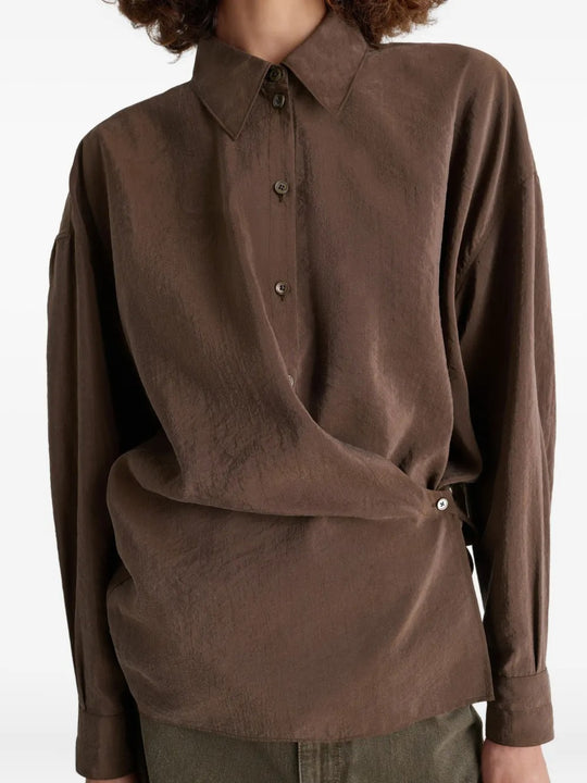 Brown shirt worn by a person, showing the shirt's fit