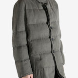 Grey jacket worn by a person, showing the jacket's fit