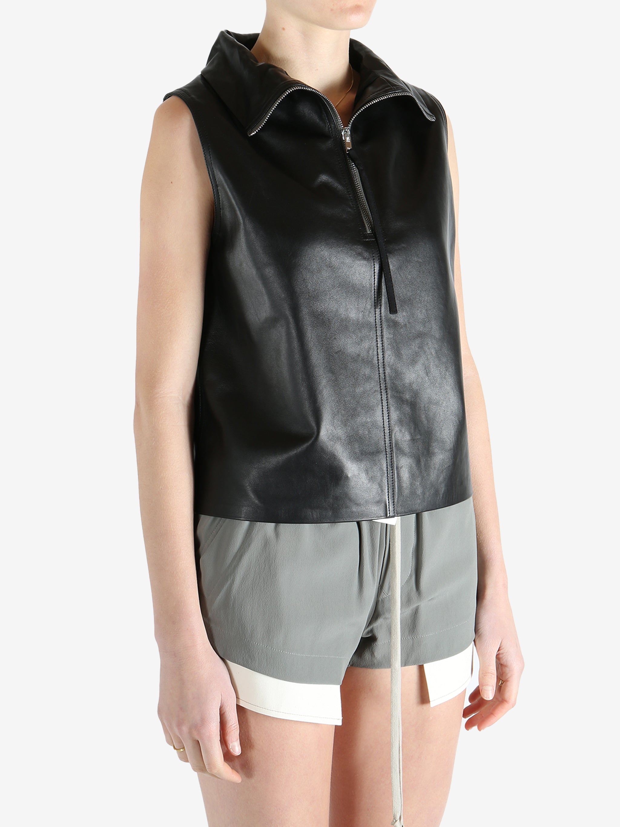 Black top worn by a person, showing the top's fit