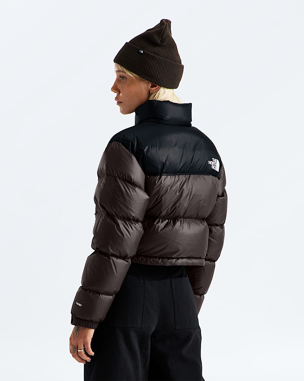Brown jacket worn by a person, showing the jacket fit