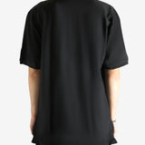 Black T-shirt worn by a person, showing the T-shirt's fit