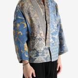 Blue jacket worn by a person, showing the jacket's fit