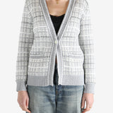 Grey knitwear worn by a person, showing the cotton fit