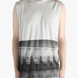 White top worn by a person, showing the top's fit