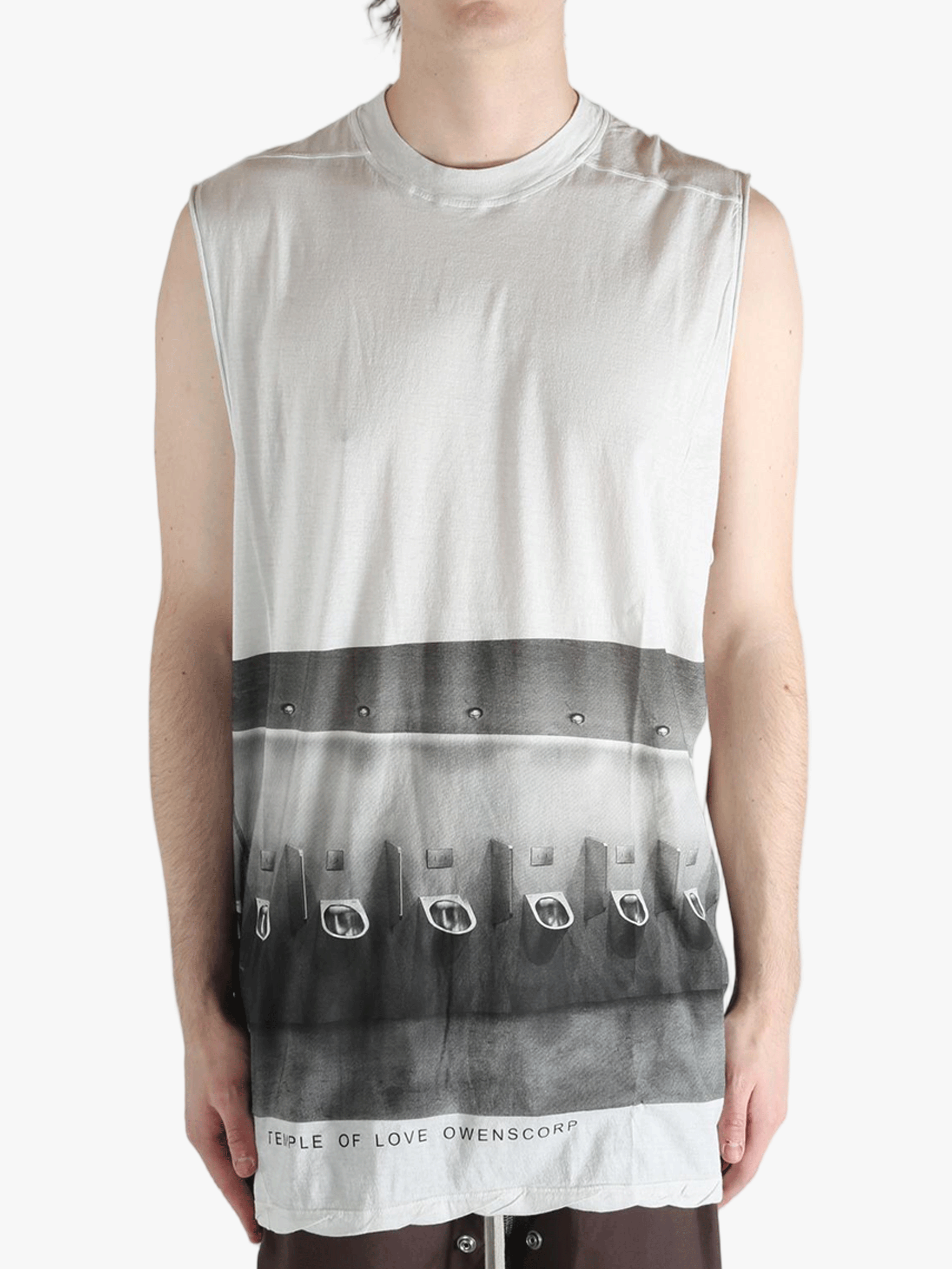 White top worn by a person, showing the top's fit