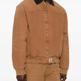 brown jackets-coats worn by a person, showing the jackets-coats fit