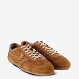 Tan sneakers, side view