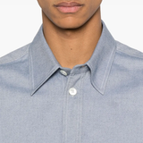 Close up of blue shirt, showing texture of the Cotton fabric