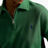 Green sweatshirt worn by a person, showing the sweatshirt‘s fit