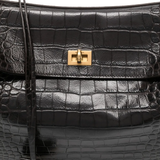 Close up of black bag, showing texture of the leather fabric
