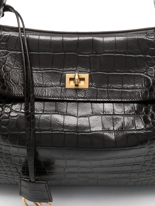 Close up of black bag, showing texture of the leather fabric