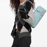 Blue bag worn by a person, showing the bag's fit