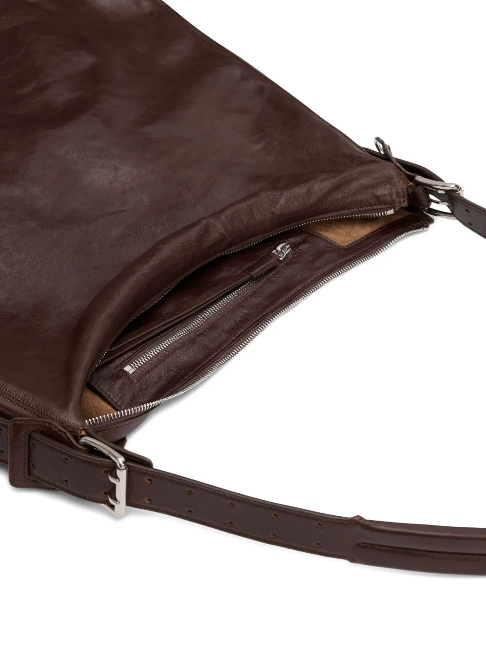 Close up of the brown bag, showing texture of the leather fabric