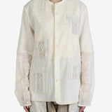 White shirt worn by a person, showing the shirt's fit