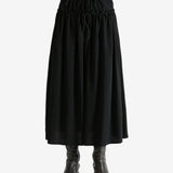 Black skirt worn by a person, showing the skirt fit
