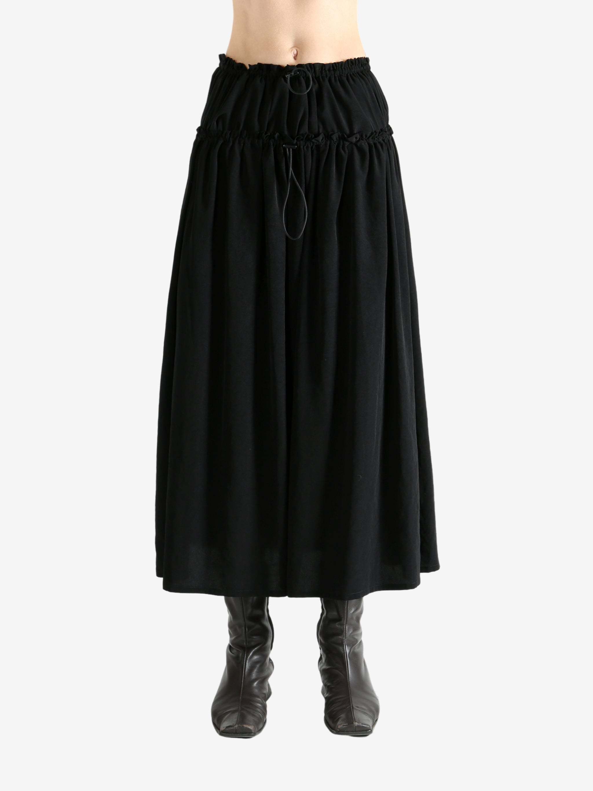 Black skirt worn by a person, showing the skirt fit