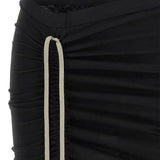 Close up of black skirt, showing texture of the cotton fabric