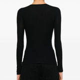 Black T-shirt worn by a person, showing the shirt’s fit