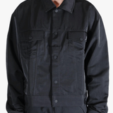 Black jacket worn by a person, showing the jackets fit