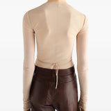 Tan top worn by a person, showing the top fit