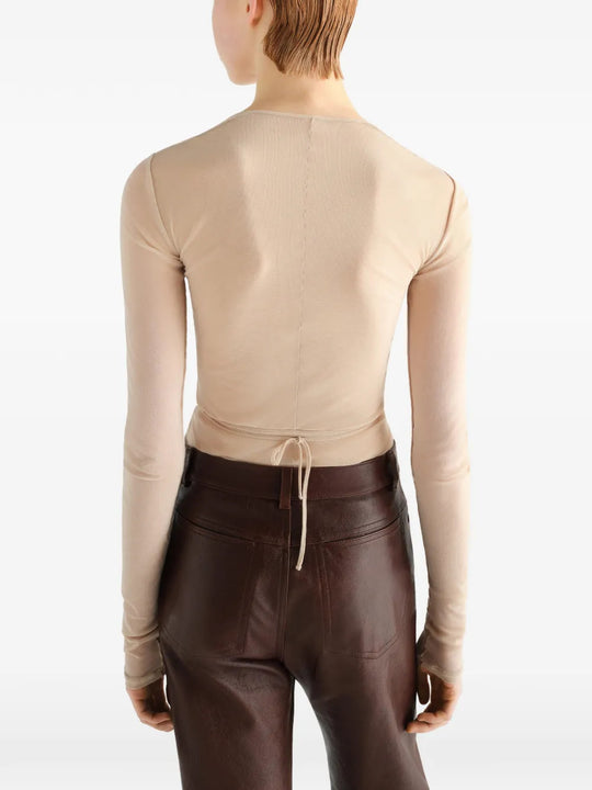 Tan top worn by a person, showing the top fit