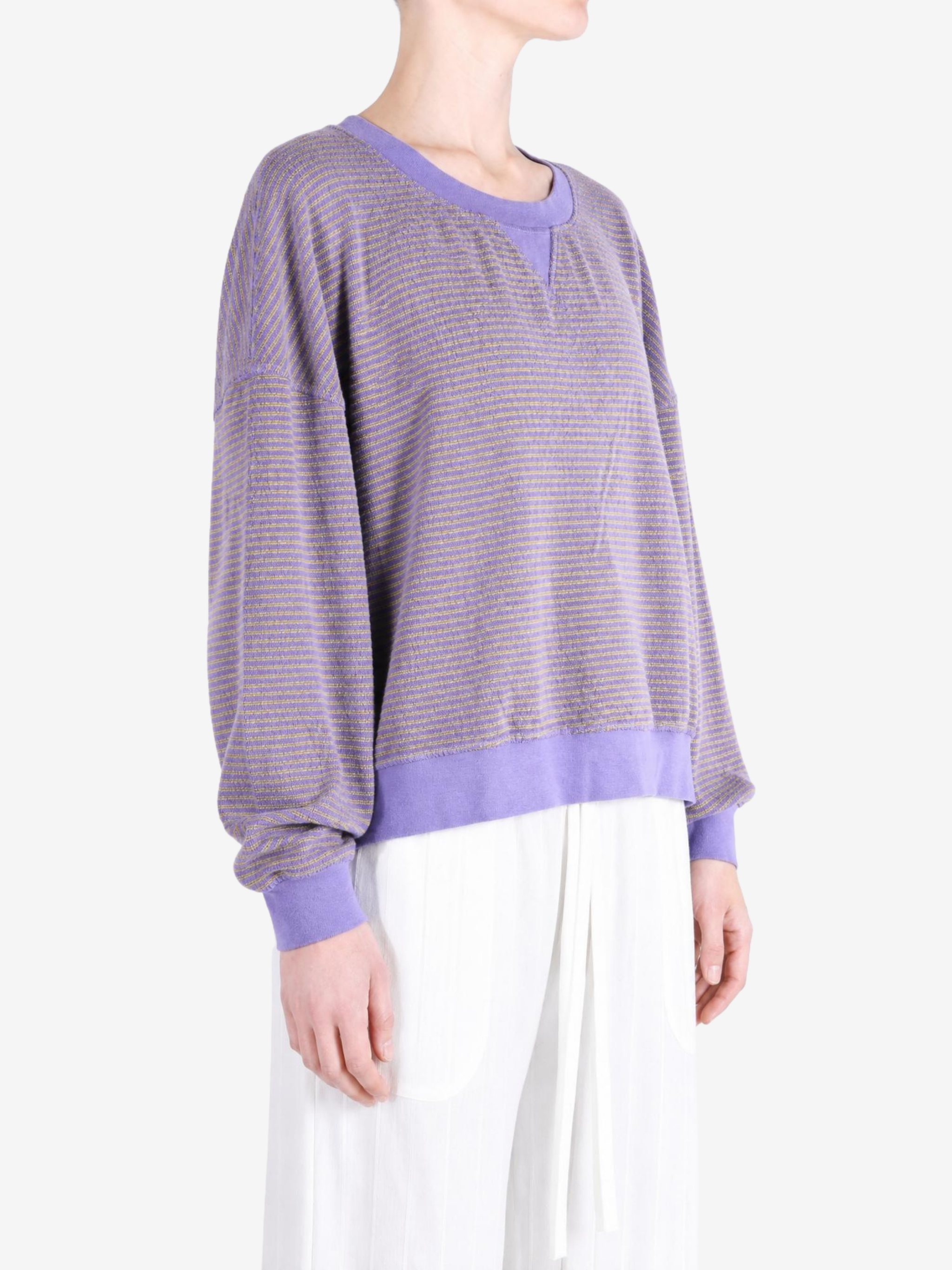 Purple hoodie worn by a person, showing the hoodie fit