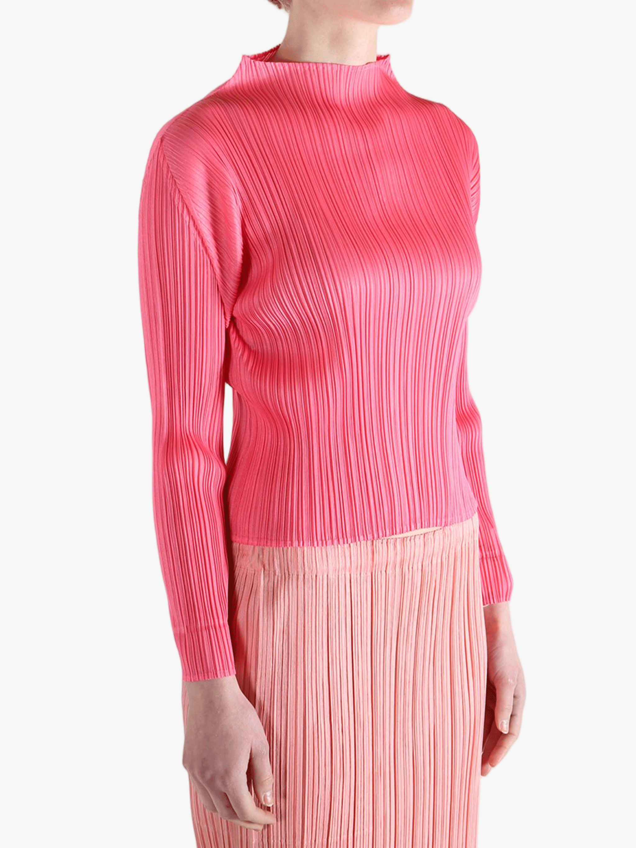 Pink shirt worn by a person, showing the shirt's fit